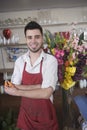 Portrait Of Happy Florist Holding Scissors