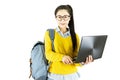 Portrait of a happy friendly casual girl student asian in glasses with backpack holding laptop isolated over white background Royalty Free Stock Photo