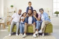 Portrait of happy, friendly and loving family of three generations sitting together on sofa at home Royalty Free Stock Photo