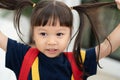 Portrait of happy and funny Asian child girl on white background, a child looking at camera. Preschool kid dreaming fill with Royalty Free Stock Photo