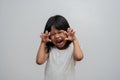 Portrait of happy and funny Asian child girl on white background, a child looking at camera. Preschool kid dreaming fill with Royalty Free Stock Photo