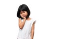 Portrait of happy and funny Asian child girl on white background, a child looking at camera hand gesture. Preschool kid dreaming Royalty Free Stock Photo