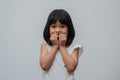 Portrait of happy and funny Asian child girl on white background, a child looking at camera. Preschool kid dreaming fill with Royalty Free Stock Photo