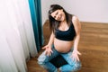 Portrait of happy future mother, waiting for baby. Pregnancy, maternity, preparation and happiness concept