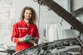 portrait happy garage mechanic male worker working fix service maintenance auto vehicle engine