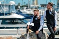 Portrait of happy gay couple in love on wedding day near yacht boat. Gay marriage. Gay couple wedding. Homosexual couple Royalty Free Stock Photo