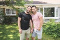A Portrait of a happy gay couple outdoors in front of a new buy Royalty Free Stock Photo
