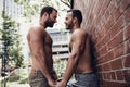 A Portrait of a happy gay couple outdoors in urban background Royalty Free Stock Photo