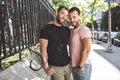 A Portrait of a happy gay couple outdoors in urban background Royalty Free Stock Photo