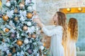 Portrait of happy girl decorating Christmas tree