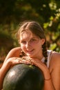 Portrait of happy girl enjoing and eating watermelon outdoors, slow life. Summer lifestyle Royalty Free Stock Photo