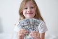 Portrait of happy girl holding cash dollars Royalty Free Stock Photo