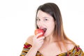 Portrait of happy girl holding eating red apple Royalty Free Stock Photo