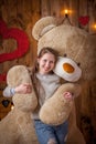 Portrait of a happy girl with a huge bear Royalty Free Stock Photo