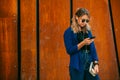 Portrait of a happy girl listening music on line with headphones from a smartphone in the street in a summer sunny day. Woman list Royalty Free Stock Photo