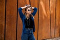 Portrait of a happy girl listening music on line with headphones from a smartphone in the street in a summer sunny day. Woman list Royalty Free Stock Photo