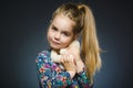 Portrait of happy girl playing with Toy dog isolated on gray Royalty Free Stock Photo