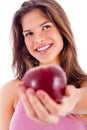 Portrait of happy girl showing red apple Royalty Free Stock Photo