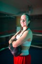 Portrait of happy girl standing on boxing ring Royalty Free Stock Photo