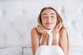 Portrait of happy girl,woman relaxing in bedroom after sleep at home in the living room at cozy home Royalty Free Stock Photo