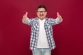 Portrait of happy glad to seeing handsome middle aged business man in casual checkered shirt and eyeglasses standing toothy smile Royalty Free Stock Photo