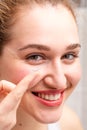 Portrait, happy gorgeous young woman smiling holding her contact lens