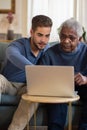 Portrait of happy granddad and his grandson resting together Royalty Free Stock Photo