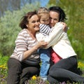 Portrait of happy grandmother, daughter and granddaughter outdoors Royalty Free Stock Photo