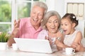 Grandparents and child singing karaoke Royalty Free Stock Photo