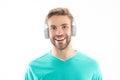 Portrait of happy guy listening to music. Guy with smiling face wearing headphones for music Royalty Free Stock Photo