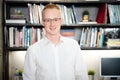 Portrait of happy handsome businessman wearing glasses and white shirt Royalty Free Stock Photo