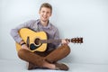 Portrait of happy handsome man playing guitar Royalty Free Stock Photo