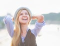 Portrait of happy hipster girl rejoicing in the city