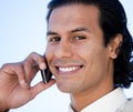 Portrait of a happy hispanic businessman on phone Royalty Free Stock Photo