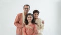 Portrait of happy Indian family standing over white background. Smart young father with little cute kids wear traditional dress, Royalty Free Stock Photo