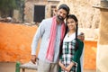 Portrait of happy Indian farmer father standing with his young daughter at village house. Mauture beard man dad and beautiful girl Royalty Free Stock Photo