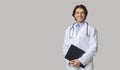 Portrait Of Happy Intern Doctor In Uniform With Clipboard In Hands Royalty Free Stock Photo