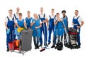 Portrait Of Happy Janitors With Cleaning Equipment Royalty Free Stock Photo