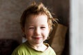 Portrait of happy joyful beautiful little boy with light hair, great hairstyle. He laughs and smiles Royalty Free Stock Photo