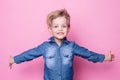 Portrait of happy joyful beautiful little boy. Studio portrait over pink background Royalty Free Stock Photo