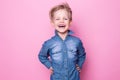 Portrait of happy joyful beautiful little boy. Studio portrait over pink background Royalty Free Stock Photo