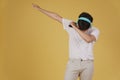 Portrait of happy joyful cheerful young asian man wearing headphones listening to music on smartphone and dancing isolated on Royalty Free Stock Photo