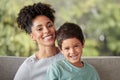 Portrait happy kid, mom and mothers day, love and care relaxing together on living room sofa in family home. Young boy Royalty Free Stock Photo