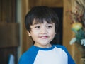 Portrait happy kid with smiling face, Close up face young boy looking out with exciting face, Positive smile child having fun and Royalty Free Stock Photo