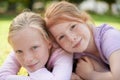 Portrait, happy kids or sisters relax in park for bond, holiday and play together with support or hug. Nature, children Royalty Free Stock Photo