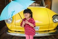 Portrait of Happy Kids with an Umbrella before Outing. Protecting Rain or Sunlight in Summer or Rainy Season Concept. Little Cute