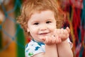 Portrait of a happy laughing baby child on playground. Close up positive kids face. Royalty Free Stock Photo