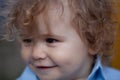 Portrait of a happy laughing child. Close up positive baby kids face. Smiling infant, cute smile.