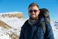 Portrait of a happy laughing Hipster traveler with a beard in sunglasses in the nature. Royalty Free Stock Photo