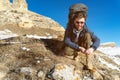 Portrait of happy laughing Hipster traveler with beard in sunglasses is sitting on nature. Royalty Free Stock Photo